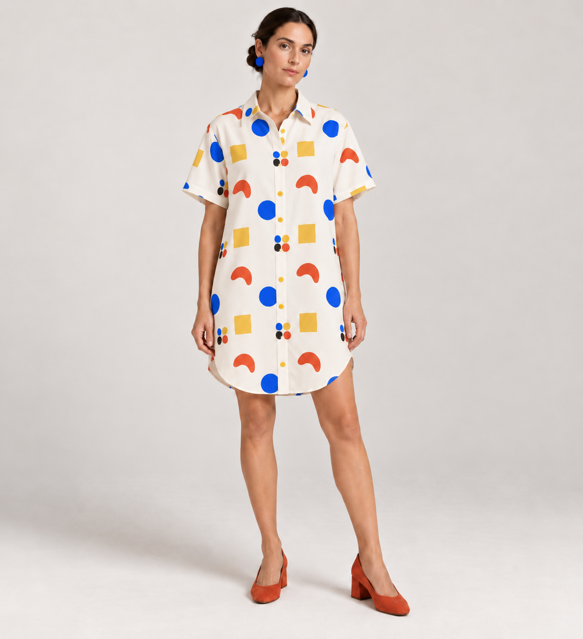 Short shirt-dress variation showing printed motifs interfering with the centre-front button line.